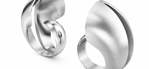 Progettazione matematica anelli scultorei in metallo satinato design gioielli contemporanei