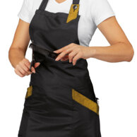 Grembiule Sherry nero e oro in tessuto antimacchia che respira e fa scivolare i capelli. 100% poliestere leggero 130 gr