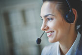 smiling-executive-using-headset.jpeg smiling-executive-using-headset.jpeg