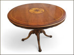 elegante-tavolo-rotondo-con-piano-intarsiato