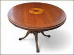 elegante-tavolo-rotondo-con-piano-intarsiato