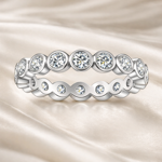 anello-eternity-castoni-rotondi-moissanite-da-01-ct-argento-925