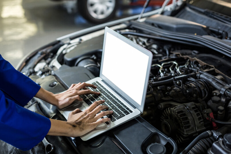 hands-female-mechanic-using-laptop.jpeg