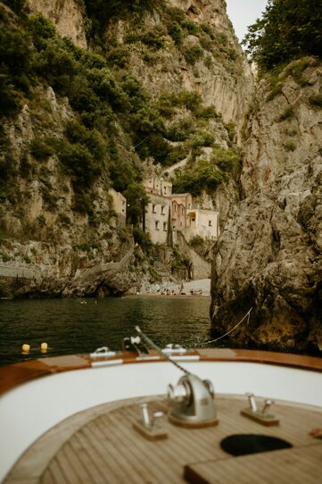 Positano village view from the sea with colorful houses and cliffs