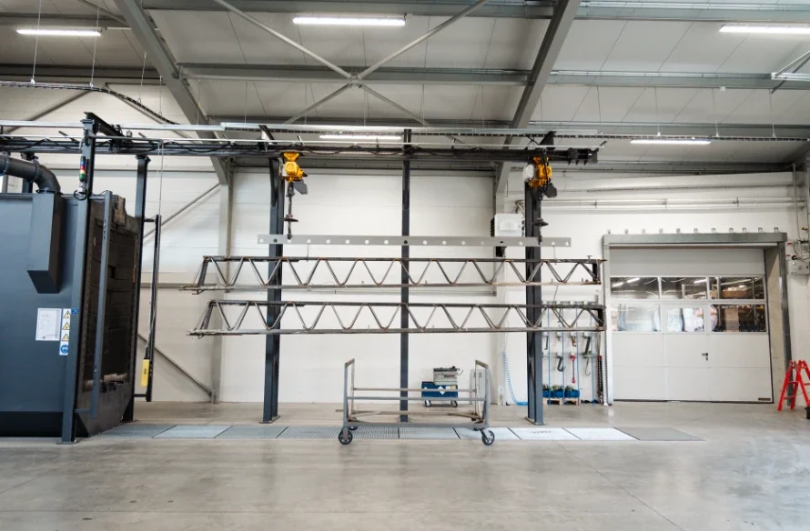 pass-through-monorail-shot-blasting-machine-workpieces.webp