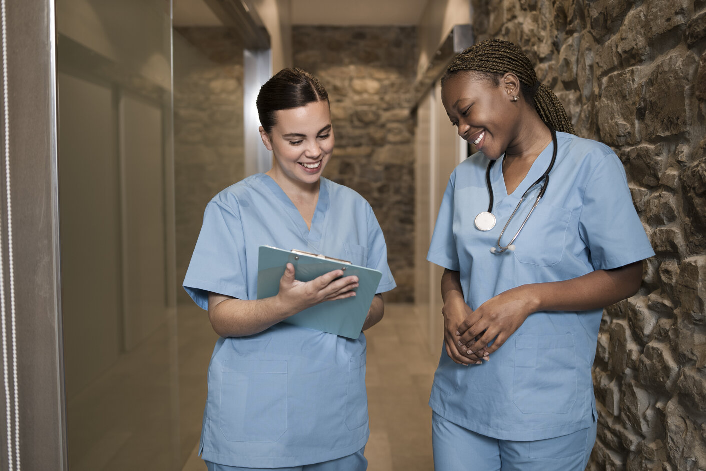 two-female-nurses-working-clinic-scrubs.jpeg