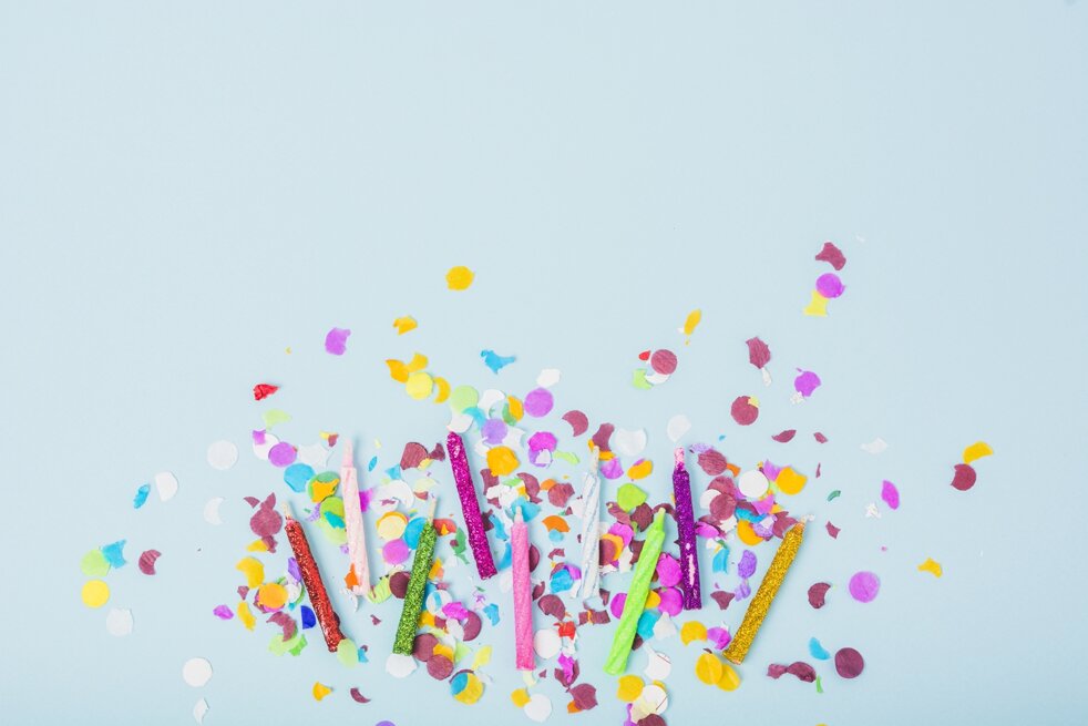 colorful-candles-with-confetti-blue-background.jpeg