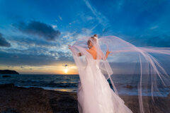 elegant-woman-in-wedding-dress-on-beach-at-sunset-2026-09-23-12-02-17-utc.jpeg