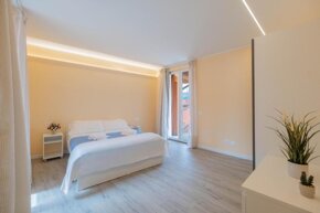 Bright bedroom at Lakeview Attico Saini in Stresa