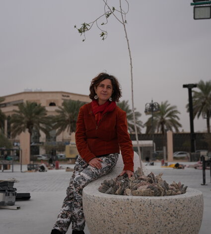 Emanuela Camacci with the stone sculpture R_esistere. Riyadh, Saudi Arabia Emanuela Camacci with the stone sculpture R_esistere. Riyadh, Saudi Arabia