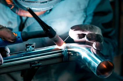 orker-performing-tig-welding-on-a-stainless-steel-pipe