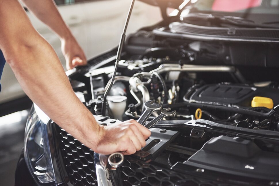close-up-hands-unrecognizable-mechanic-doing-car-service-maintenance.jpeg