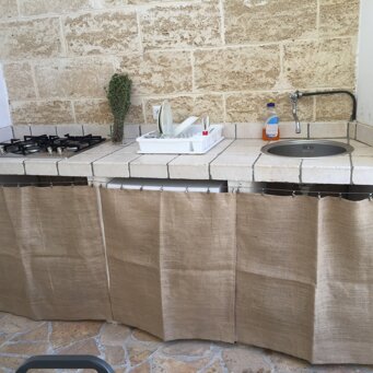 angolo cottura esterno Cucina esterna e lavatrice