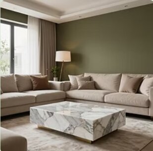 rinnovo del salotto, con tavolino pellicola adesiva effetto marmo e parete con pellicola adesiva effetto verde caldo